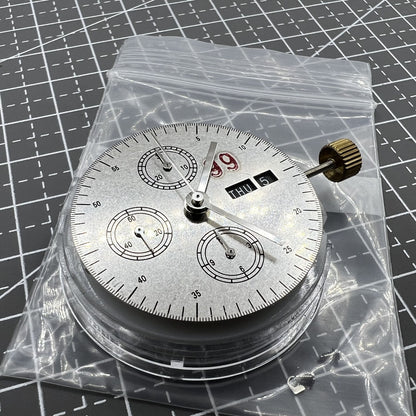 7750 black dial chronograph watch with three hands, small second at 9 o'clock, and day date display