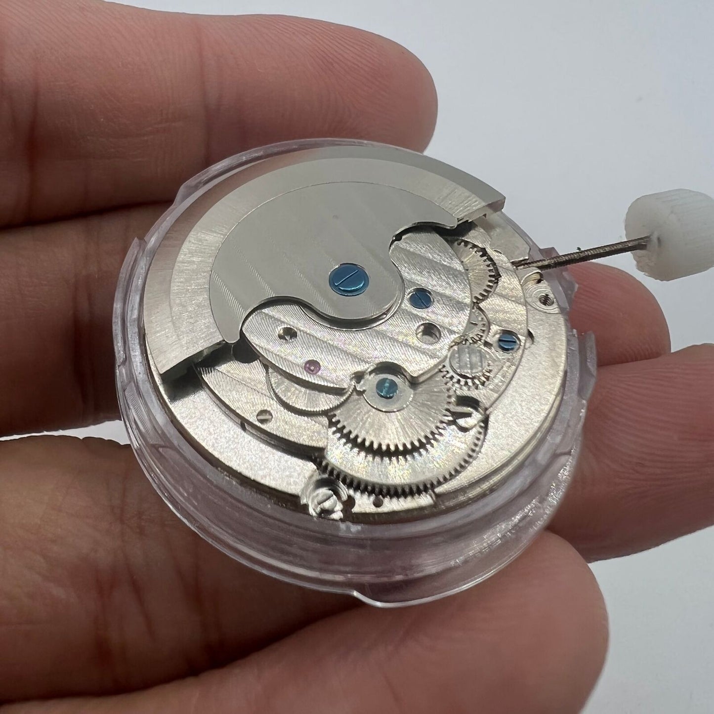 Shanghai LB20 watch showcasing moon phase at 6 o'clock, big date at 12, precise mechanical movement for accuracy.