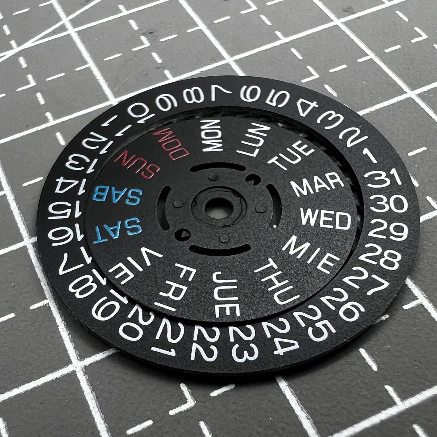Black watch accessory showing date and day wheel at 3 o'clock crown for Seiko NH36 movement.