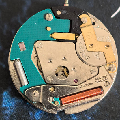 Swiss Made ETA 6640B quartz watch movement with 3 hands and green circuit board, precise timekeeping by ETA.