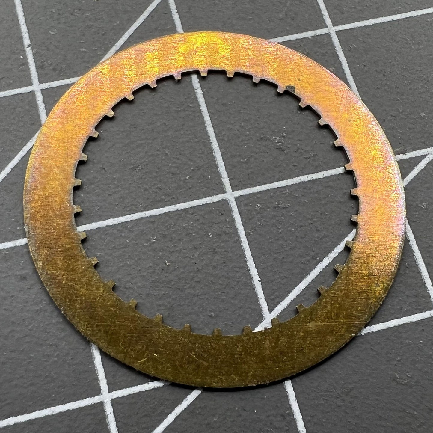 Arabic date disk wheel for ETA2824 Datejust watch, precision component on white background.