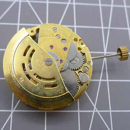 DANDONG 26.5mm 7120 automatic mechanical watch movement featuring hollow golden design for precise timekeeping and durability.