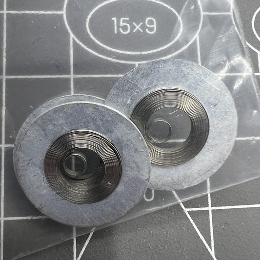 Ressort moteur argenté générique adapté au mouvement 7009#180