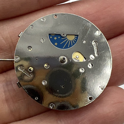 8205 automatic watch with mechanical movement, small second dial at 3, 6, and 9 o'clock positions.