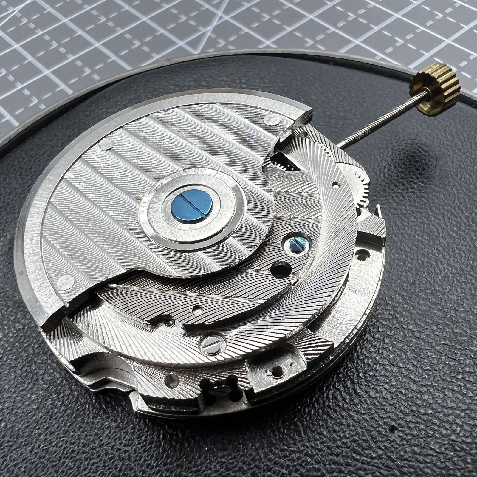 Multifunctional automatic watch featuring mechanical movement and moon phase at top dial.