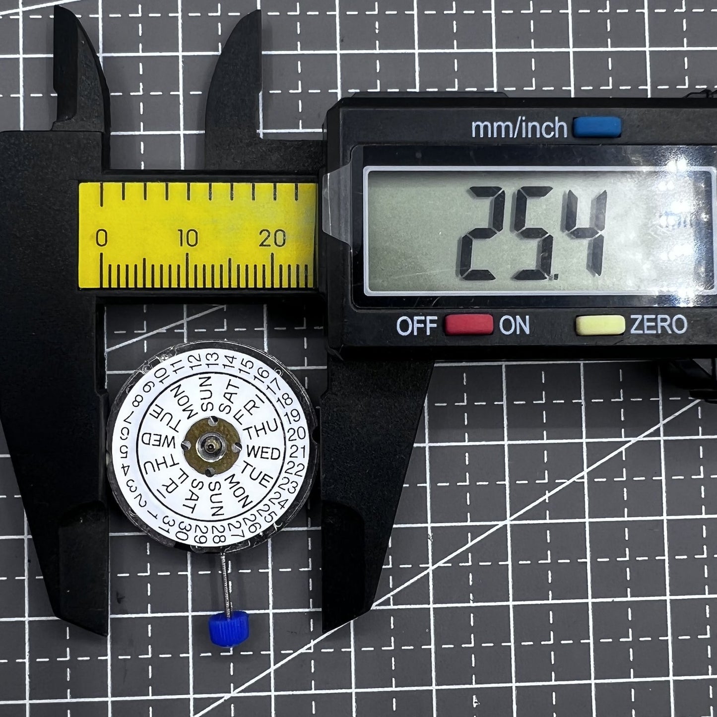 Swiss ISA 1198 quartz watch movement with 3 hands and English day-date display for precise timekeeping.