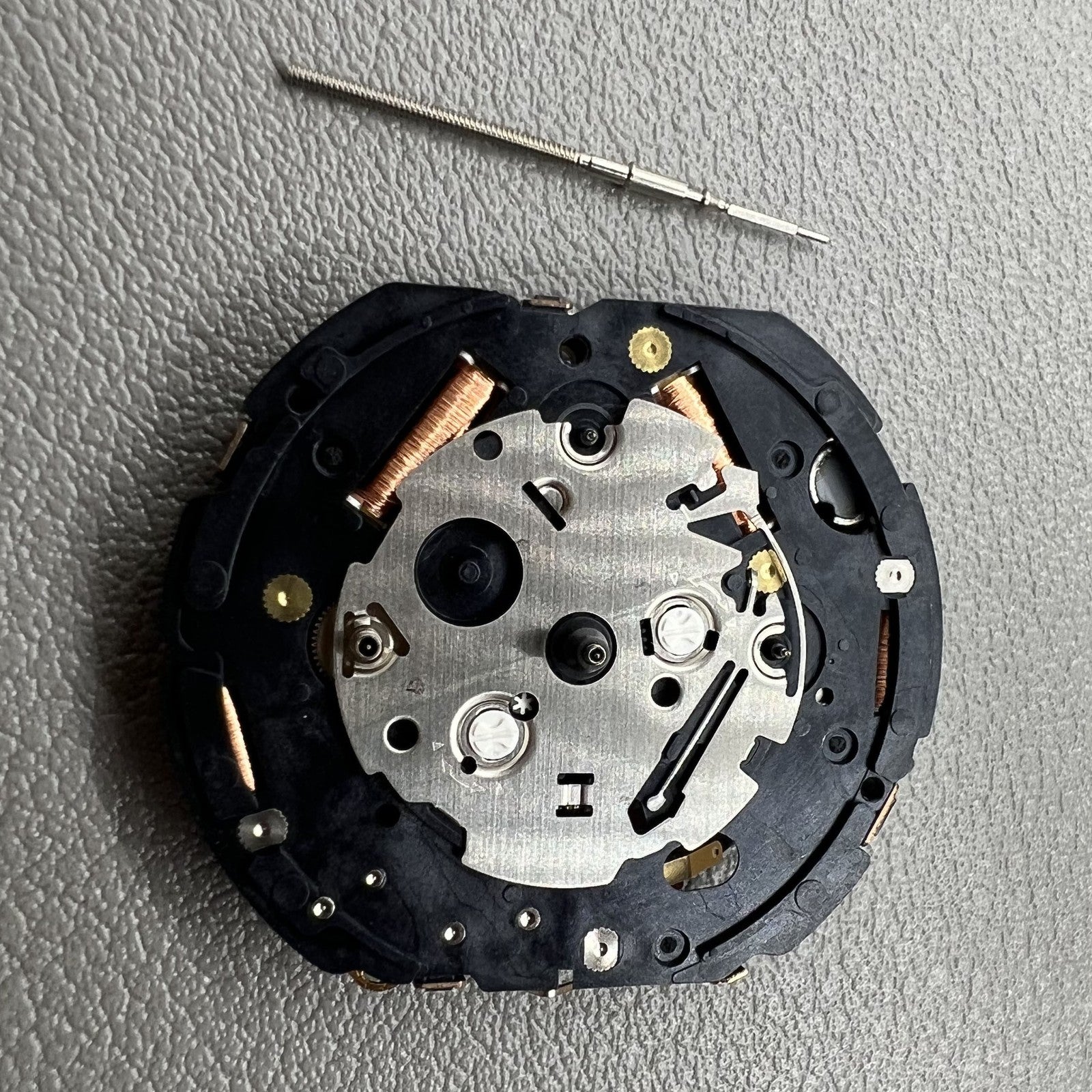 Seiko 7T86A quartz watch movement replacement part, precision Japanese craftsmanship for repairs.