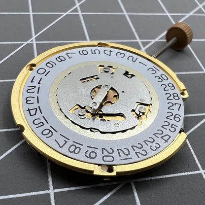 Swiss Made Ronda 6004D quartz watch movement with date window at 3 o?clock for precise timekeeping.