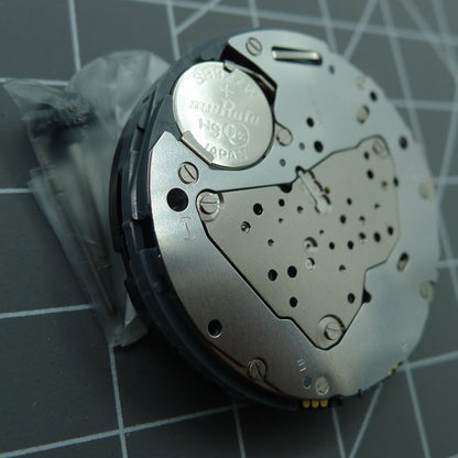 Miyota 6S50 quartz watch movement showing date at 12, three hands, and subdials at 3, 6, 9 positions.