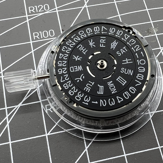 Miyota NH36A automatic watch movement with black finish, blue lume highlights, and crown positioned at 3/3.8 for precision.