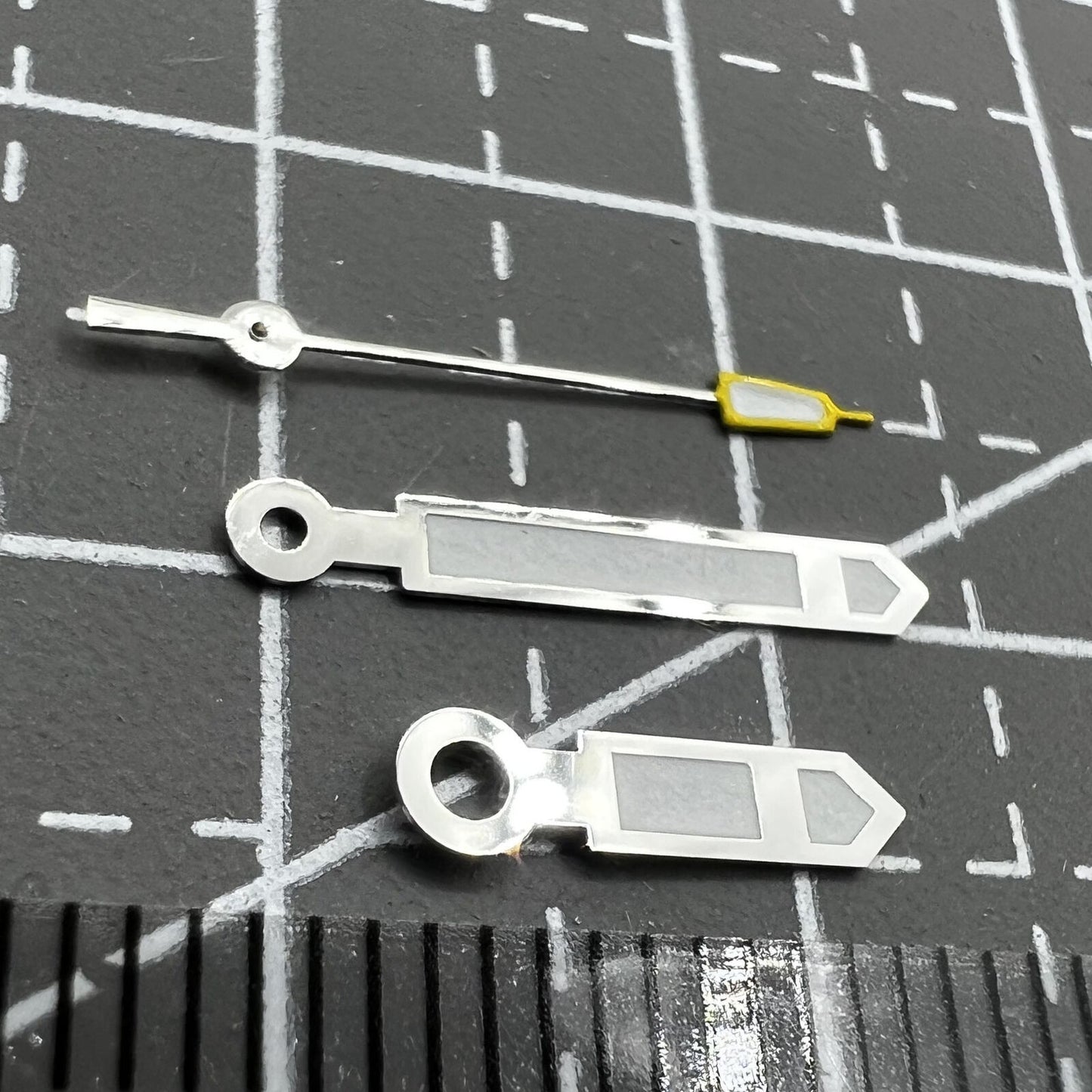 Silver and yellow pointed second watch hands for Seiko NH35 NH36, precision replacement parts, ideal for accurate timekeeping.