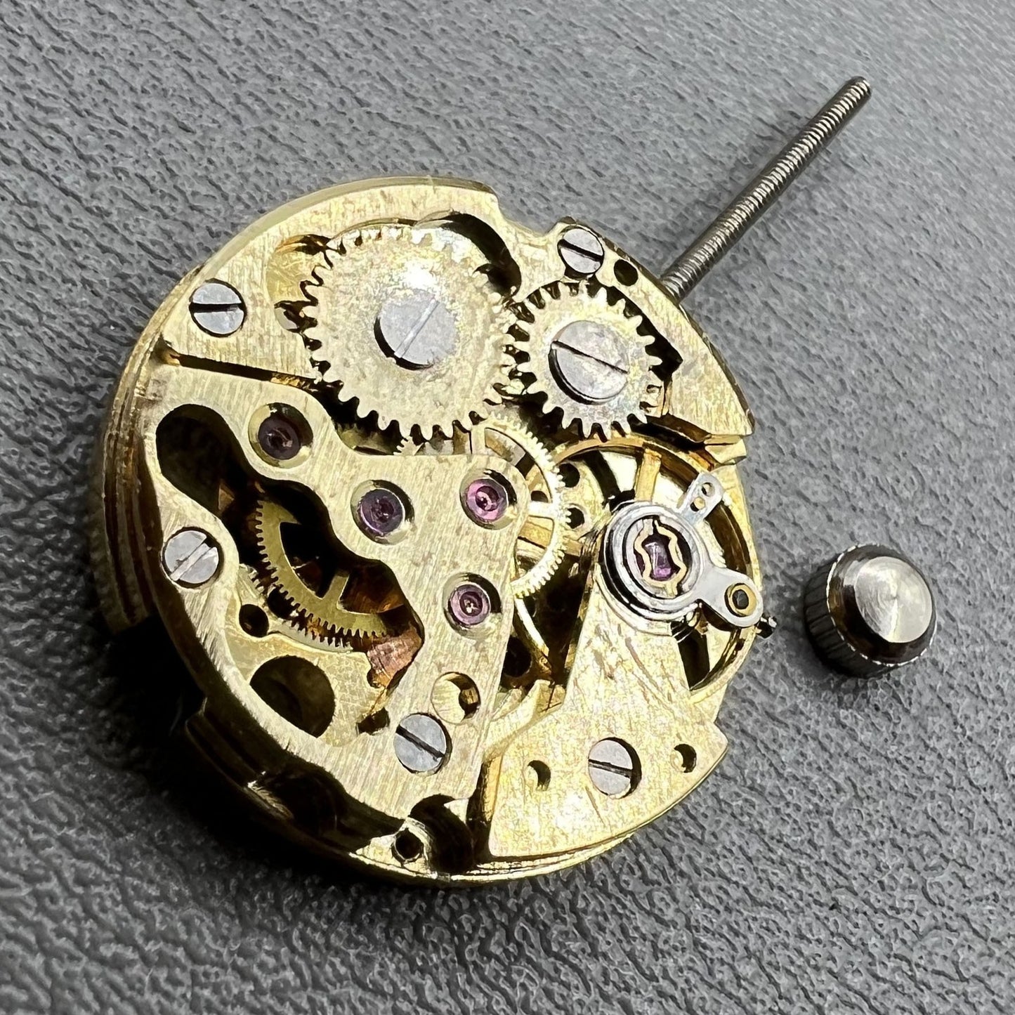 Set of 2 hollow 17.2mm golden mechanical movement cufflink parts for watchmaking.