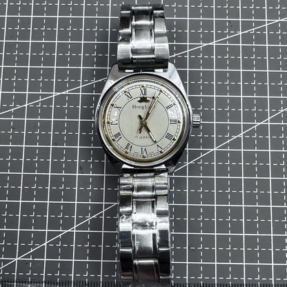 Silberne HONGLIAN mechanische Handaufzugsuhr 32mm mit r�mischen Zahlen und 17 Steinen
