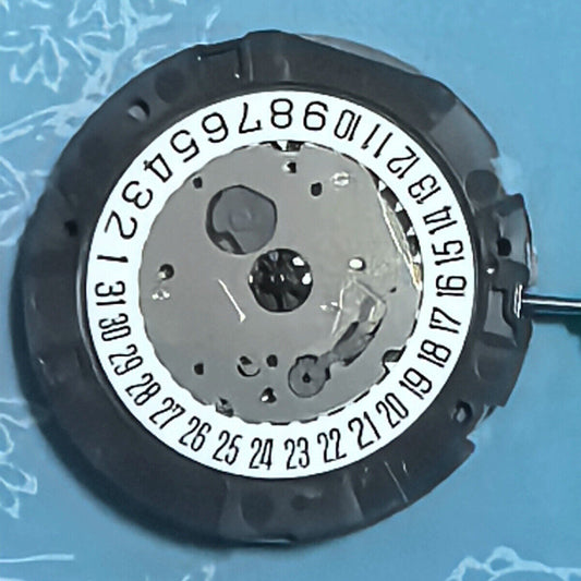 Japan Made Miyota OS21 quartz watch movement showing white disk wheel, zero jewels, precise timekeeping.