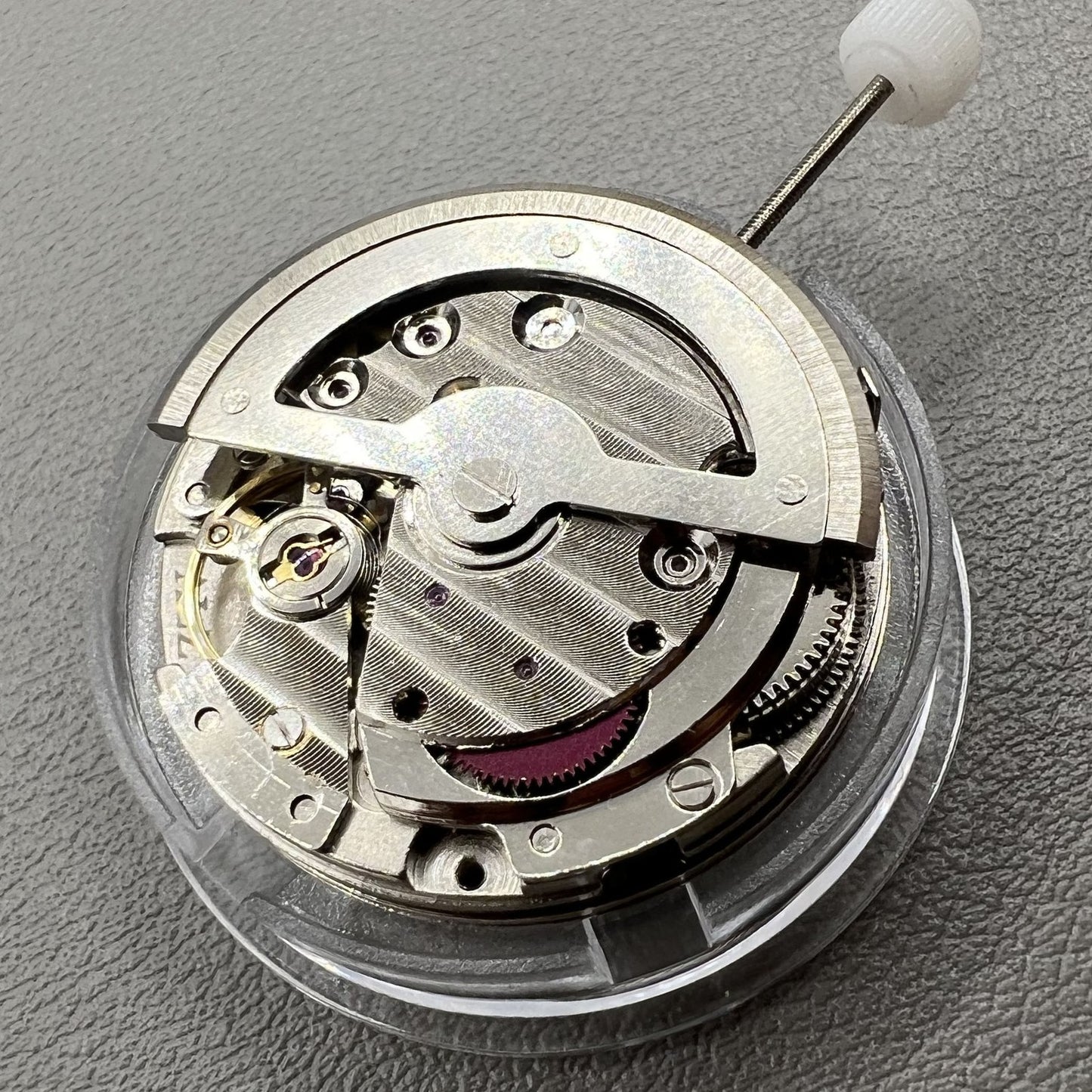 China Made 8205 automatic watch movement featuring small seconds at 3, 6, and 9 o'clock positions for precise timekeeping.