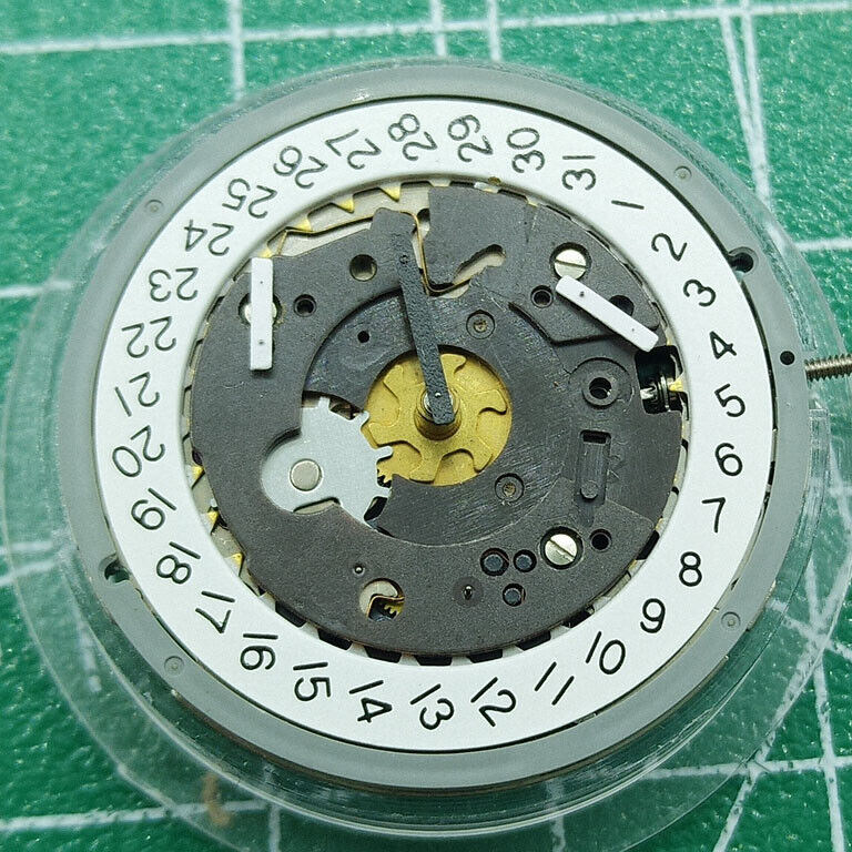 Original ISA 8162 quartz watch movement with date at 4, reliable replacement by ISA for precise timekeeping.