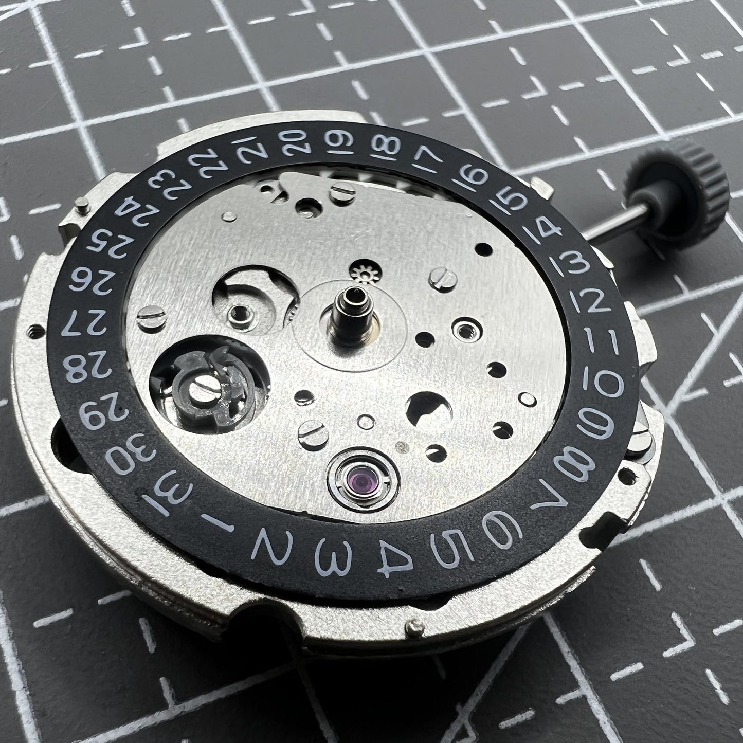 Citizen Miyota 8215 automatic mechanical watch movement with black dial and date display at 3 o'clock.