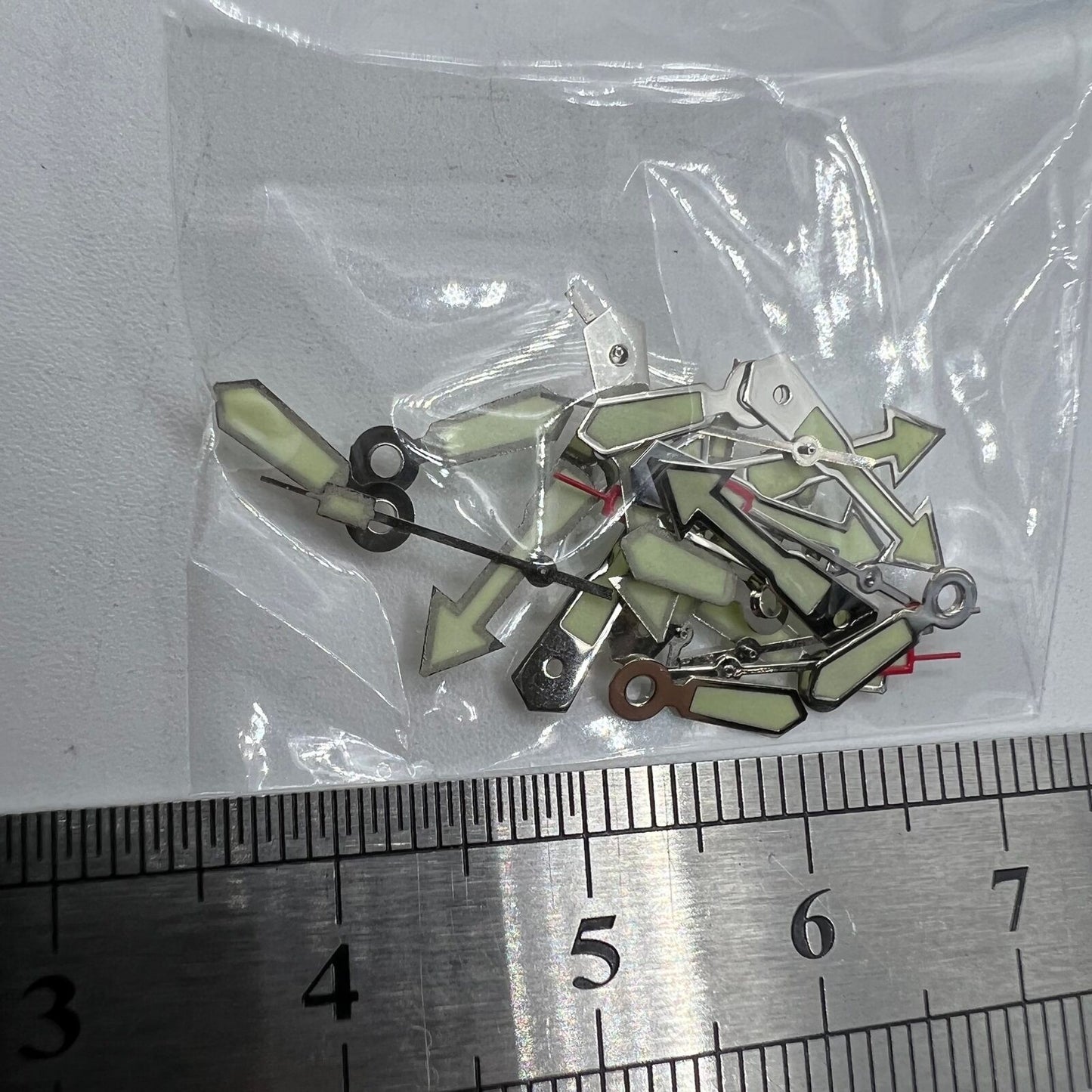 Arrow-shaped silver trim green lume watch hand for Miyota 2035, precise timekeeping.