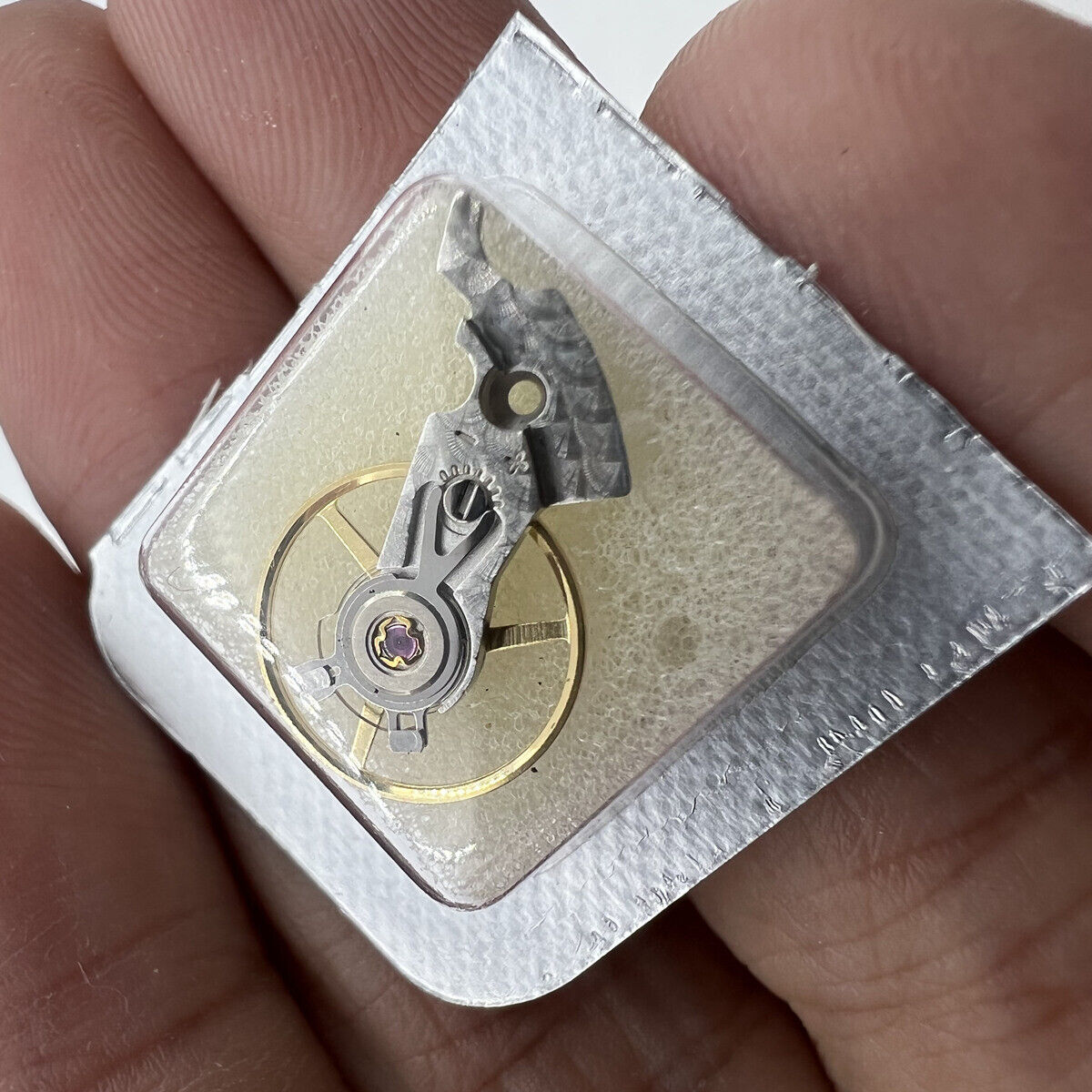 Silver China-made balance wheel splint with veins for ETA 2824/2836, enhancing precision and durability in watch repairs.