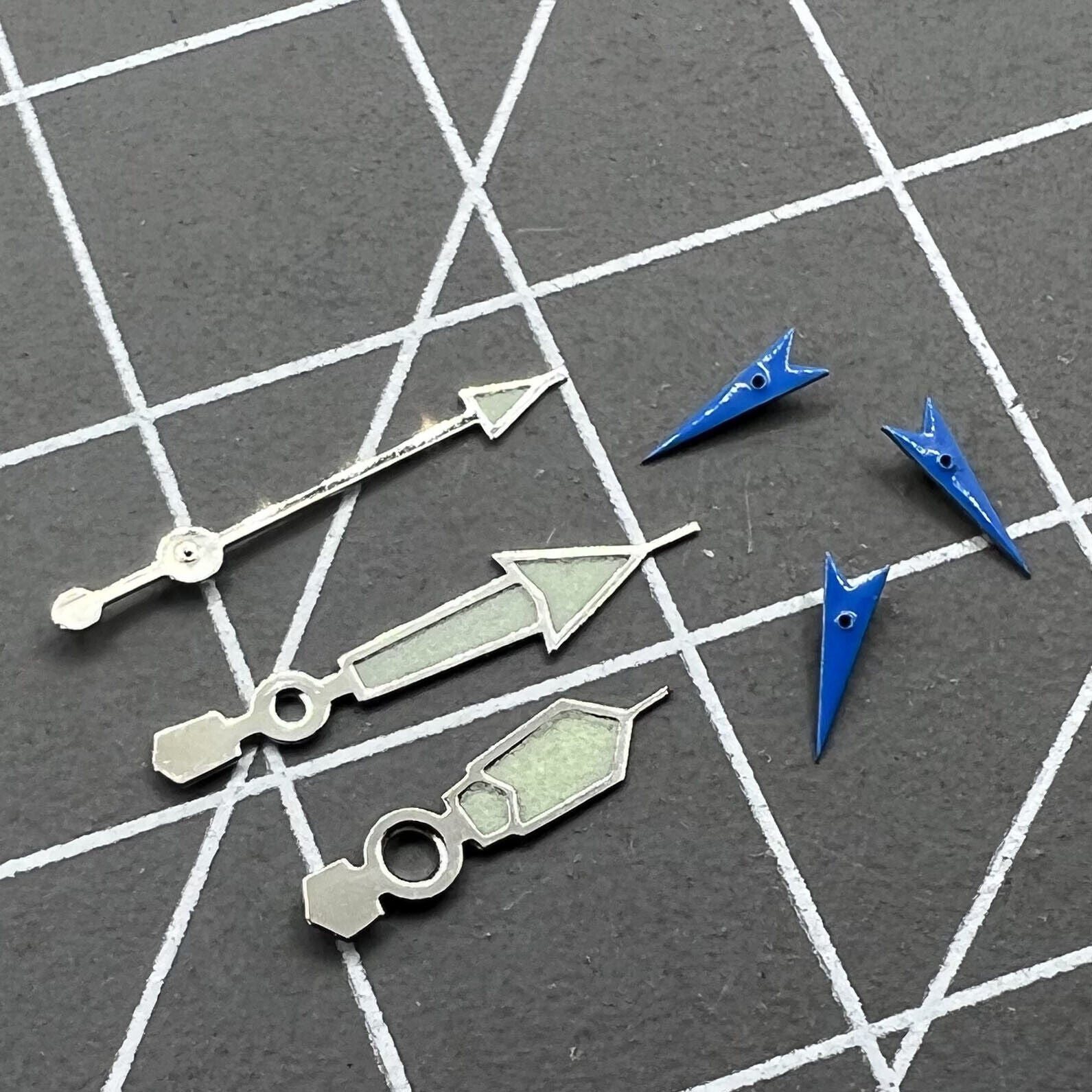 Blue luminous small second hand with silver trim for Miyota OS movements, ideal for watch repairs.