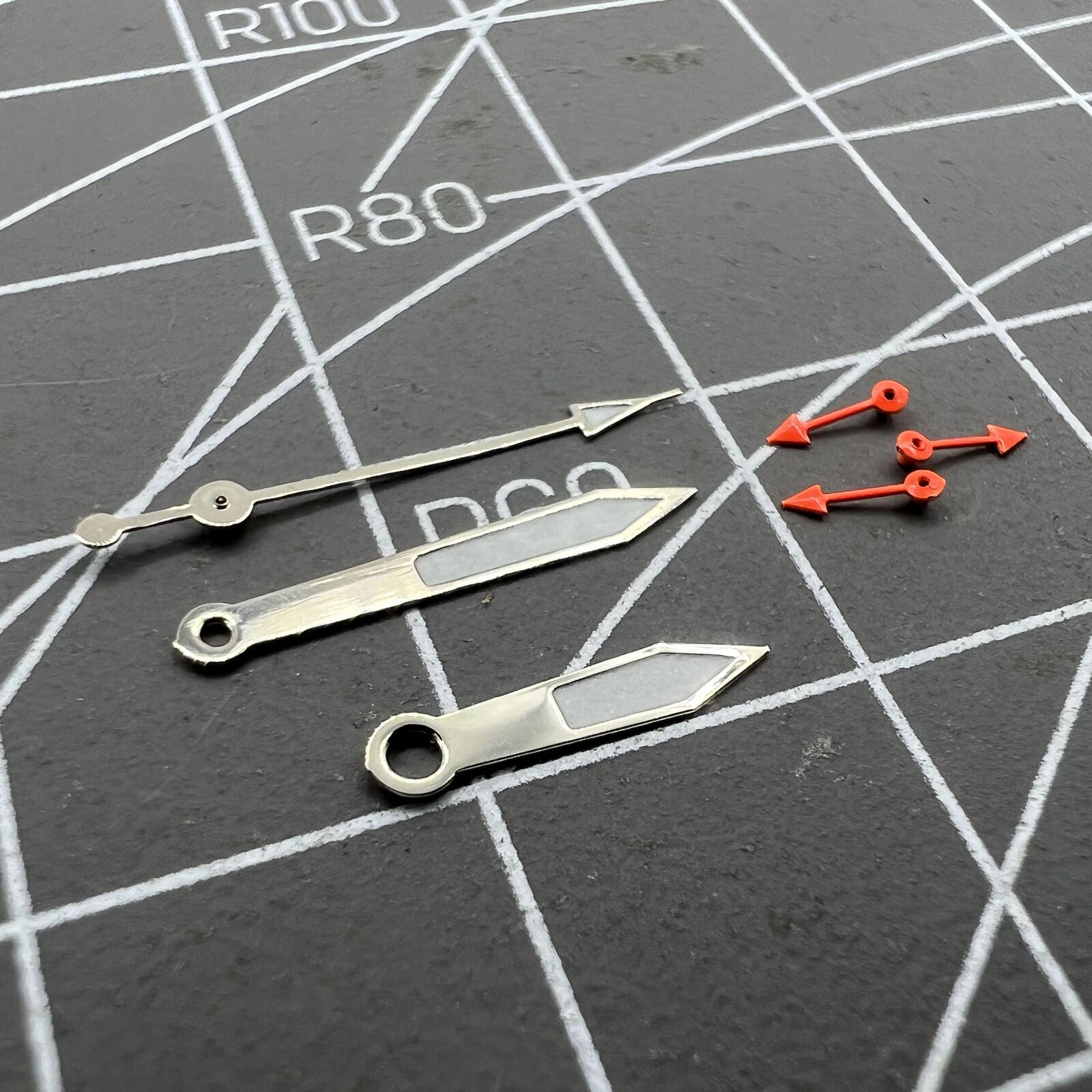 Silver-trimmed green luminous watch hands for Miyota 0S10, precise style accessory.