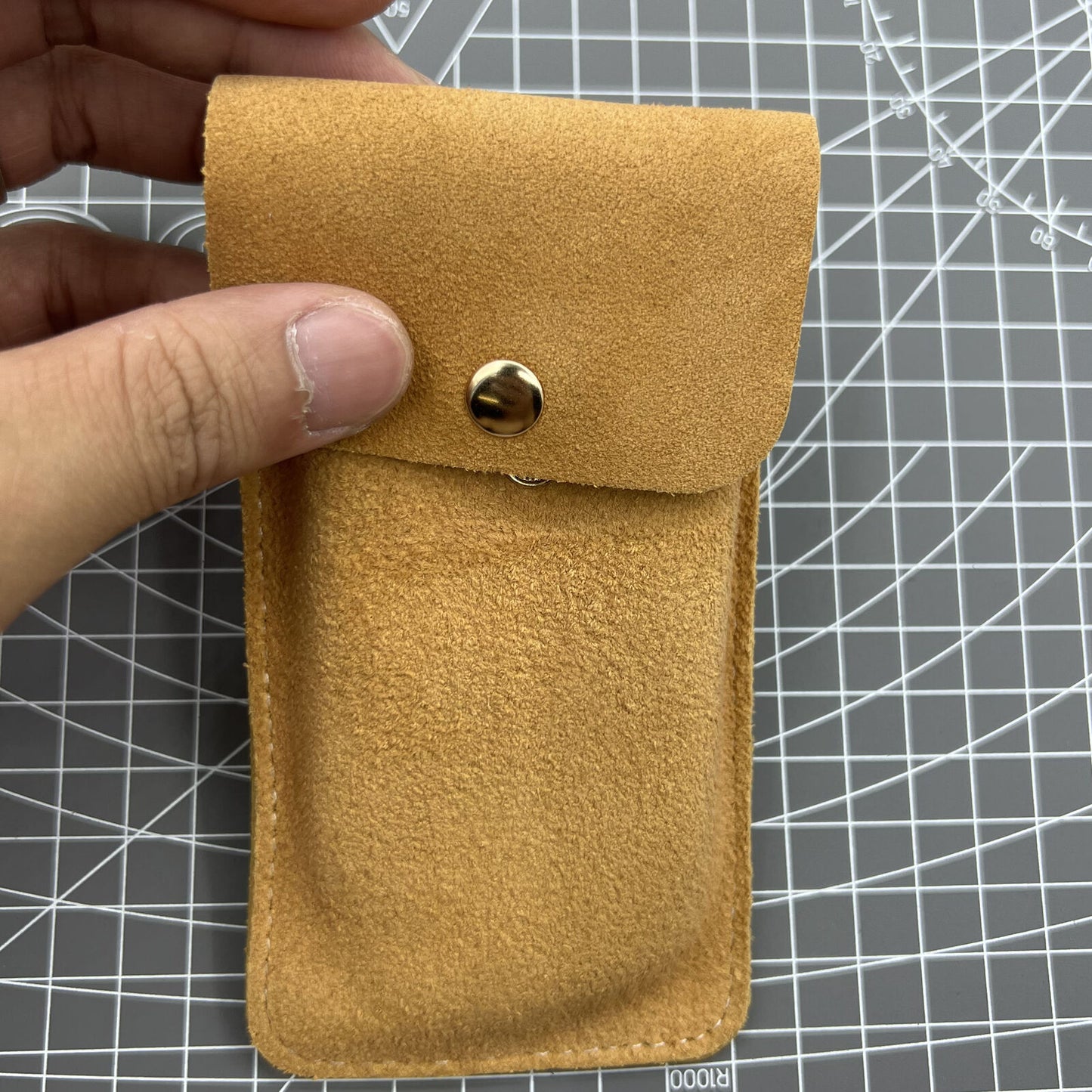 Brown Cowhide watch storage bag, portable travel pouch with soft lining for single watch protection.