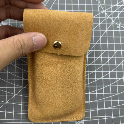 Brown Cowhide watch storage bag, portable travel pouch with soft lining for single watch protection.