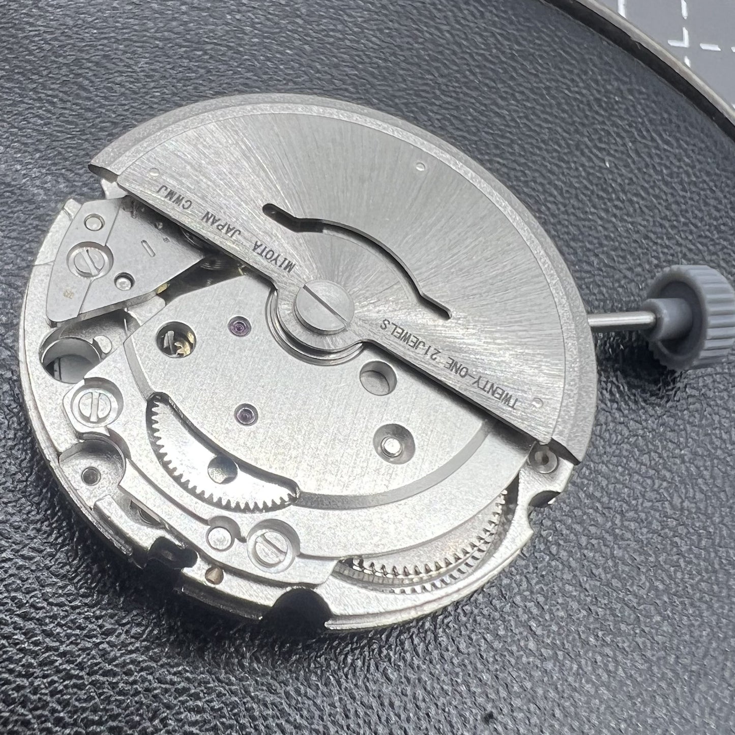 Citizen Miyota 8215 automatic mechanical watch movement with black dial and date display at 3 o'clock.