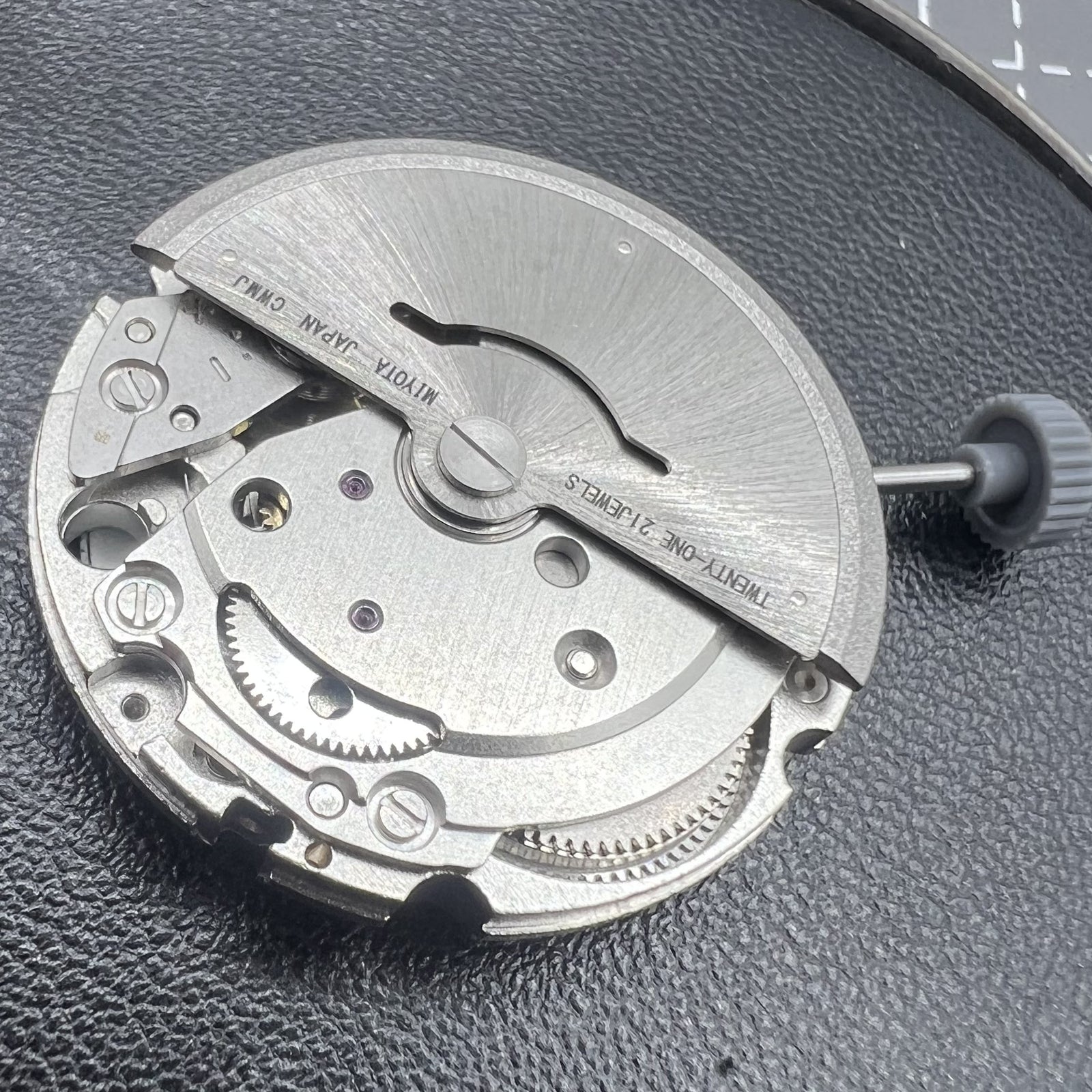 Citizen Miyota 8215 automatic mechanical watch movement with black dial and date display at 3 o'clock.