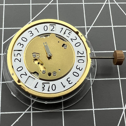Golden Swiss Made Ronda 6004B quartz watch movement with date at 12 o'clock, precise and reliable by Ronda.