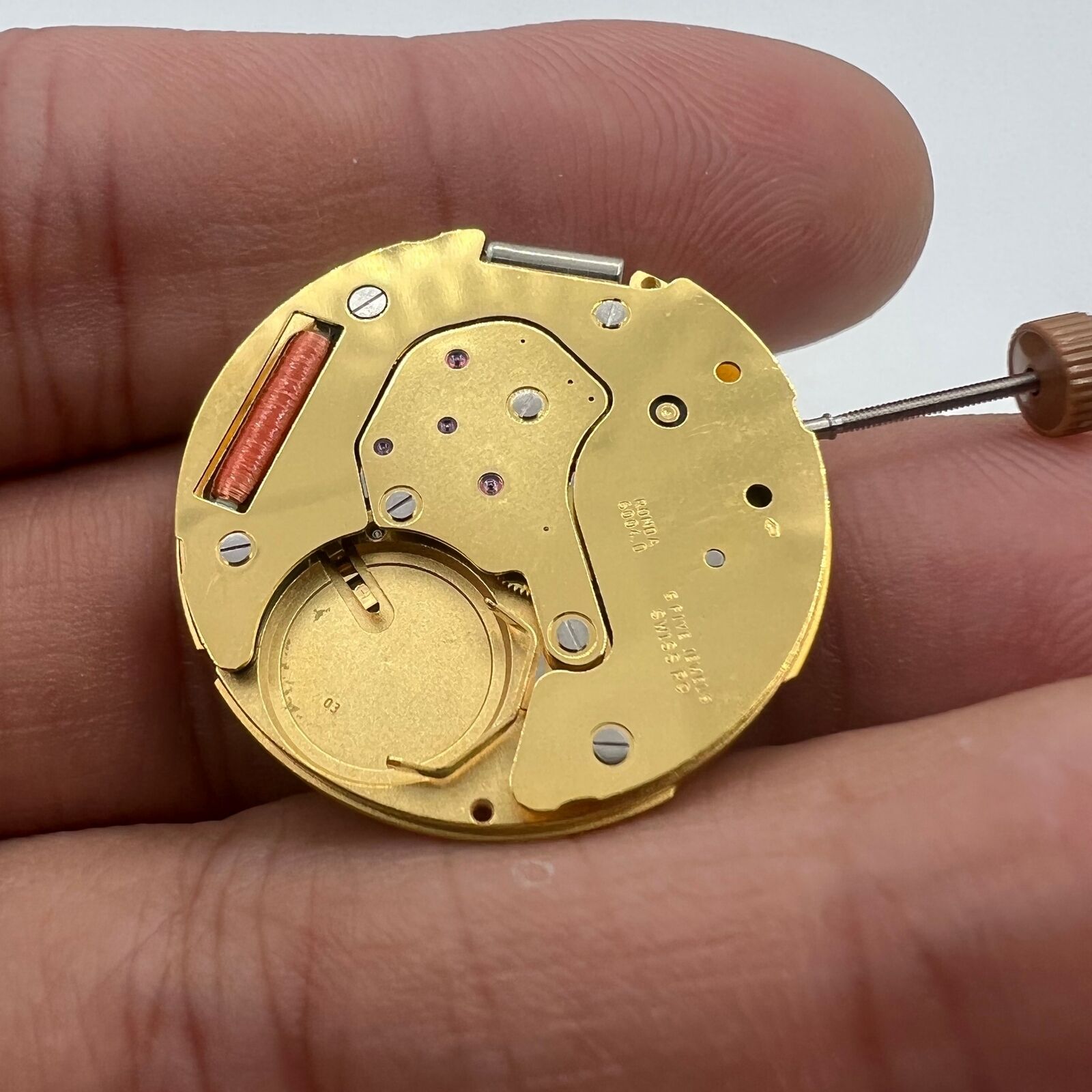 Swiss Made Ronda 6004D quartz watch movement with date window, perfect for precise watch repairs.