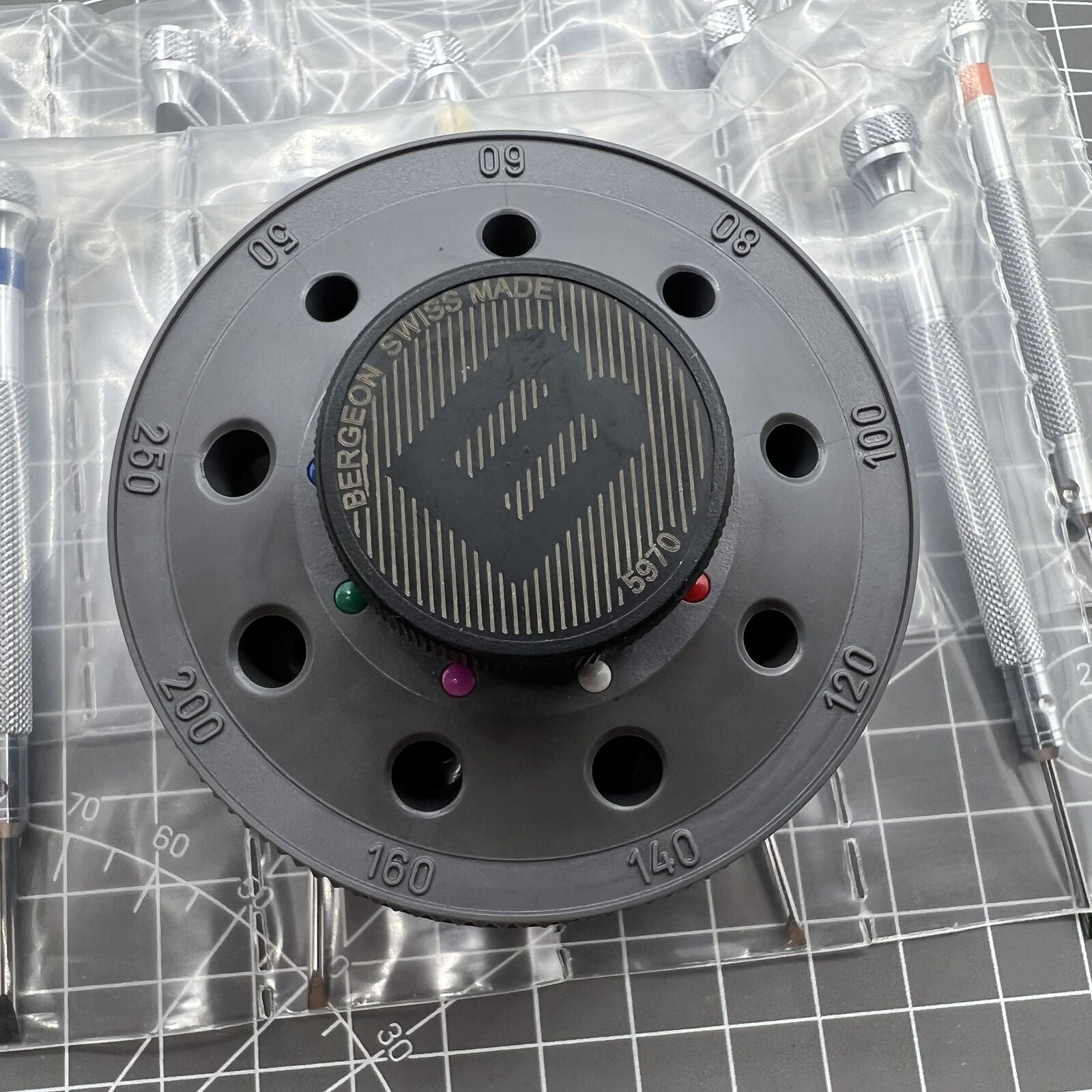 Bergeon 5970 Swiss Made rotating tool with 9 precision screwdrivers for detailed watch repairs and adjustments.