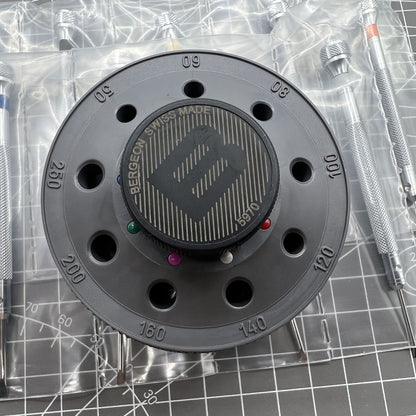 Bergeon 5970 Swiss Made rotating tool with 9 precision screwdrivers for detailed watch repairs and adjustments.