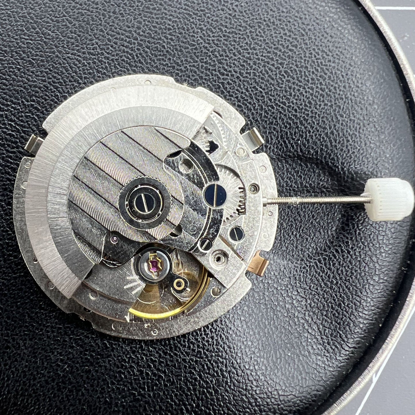 Mechanical automatic watch accessory with multi-function 3 hands and big date display, precision branded.