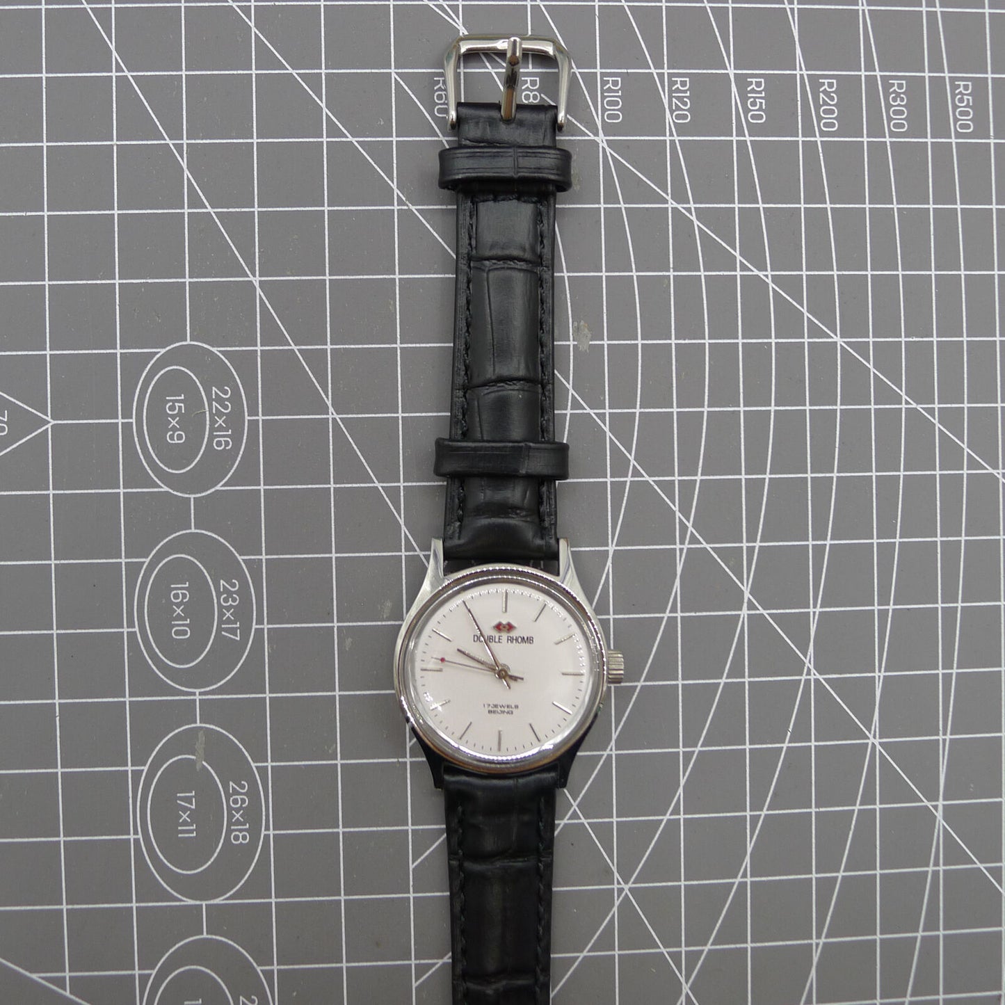 Silver 31mm Beijing Double Rhomb manual watch with three hands, elegant design for classic style.