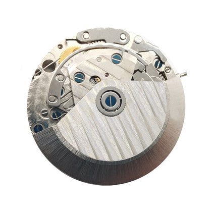 Close-up of Asian 7750 automatic chronograph movement showing day-date display at 3 o'clock, precision ETA 7750 style.