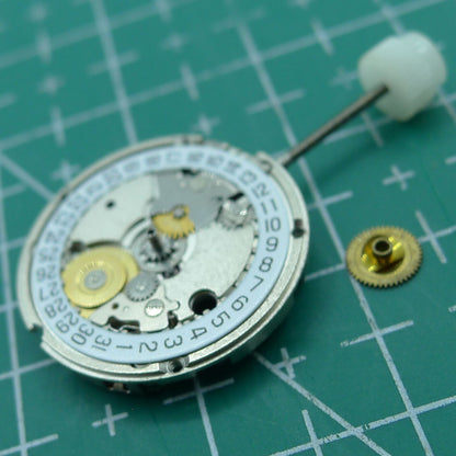 Wholesale ETA 956.114 quartz watch movement with white dial, 3-hand display by ETA for precise repair and replacement.