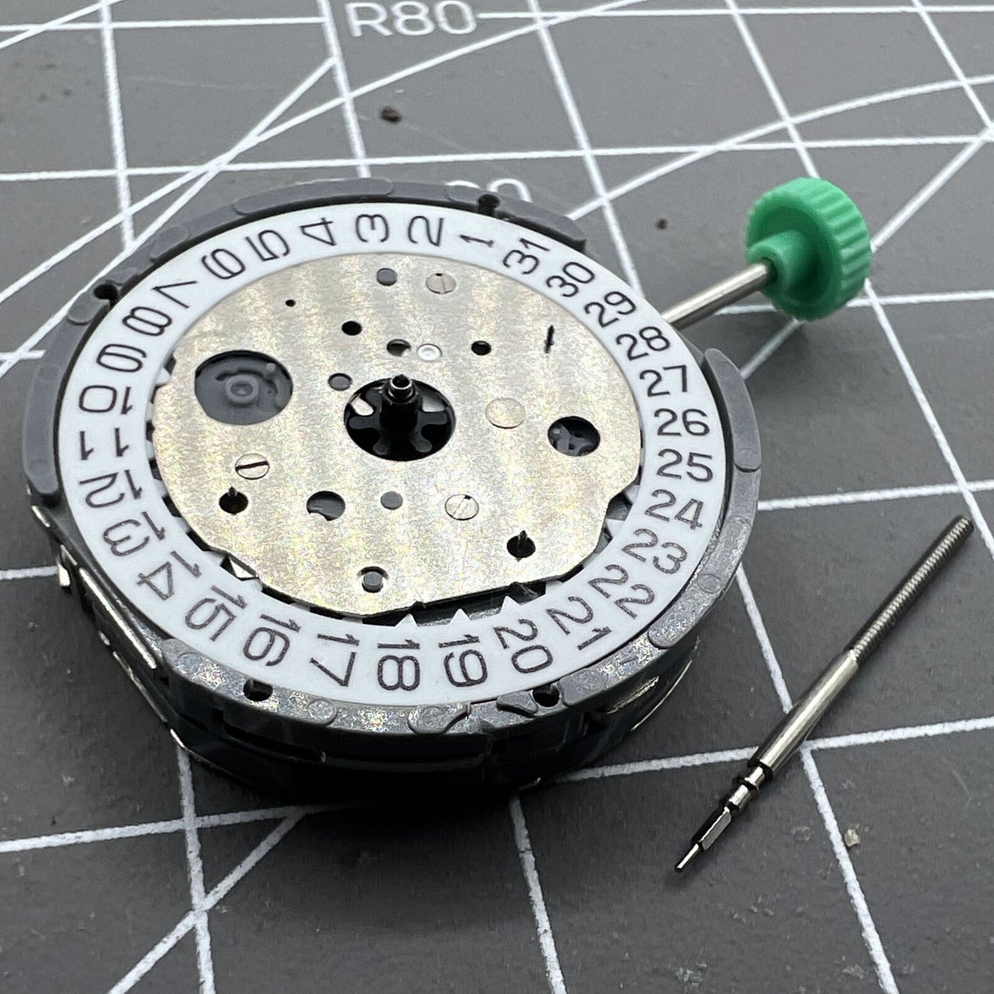 Miyota FS20 chronograph watch movement with date at 3, Japan-made quartz precision.