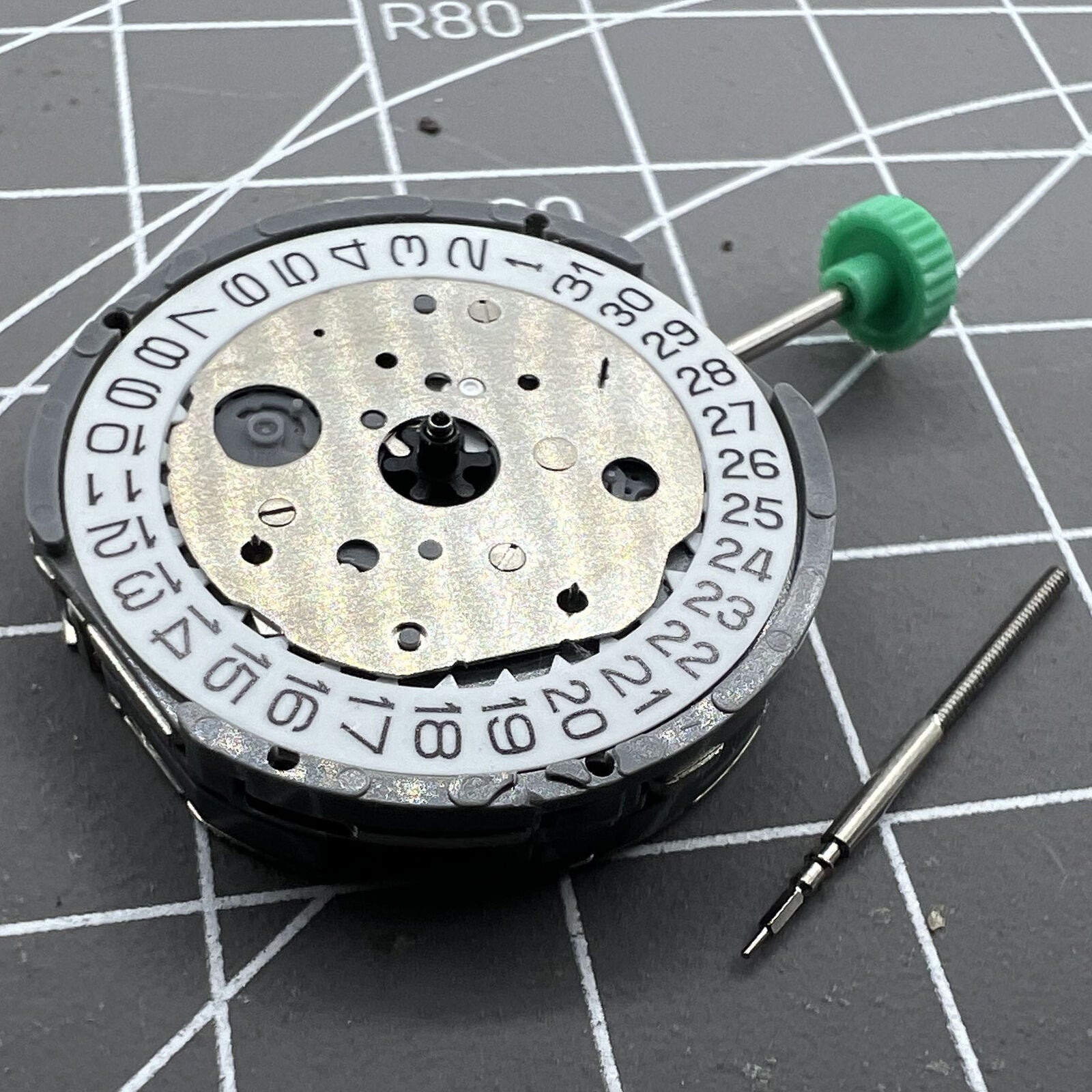 Miyota FS20 chronograph watch movement with date at 3, Japan-made quartz precision.