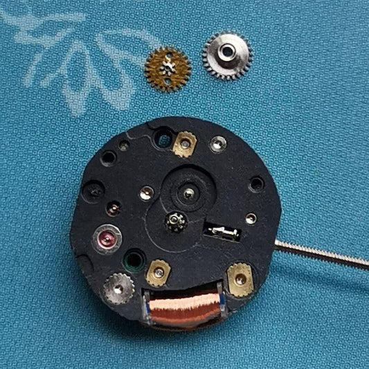 Epson YL50A quartz watch movement with 5 jewels and 2 hands, Japan-made for precise repairs.