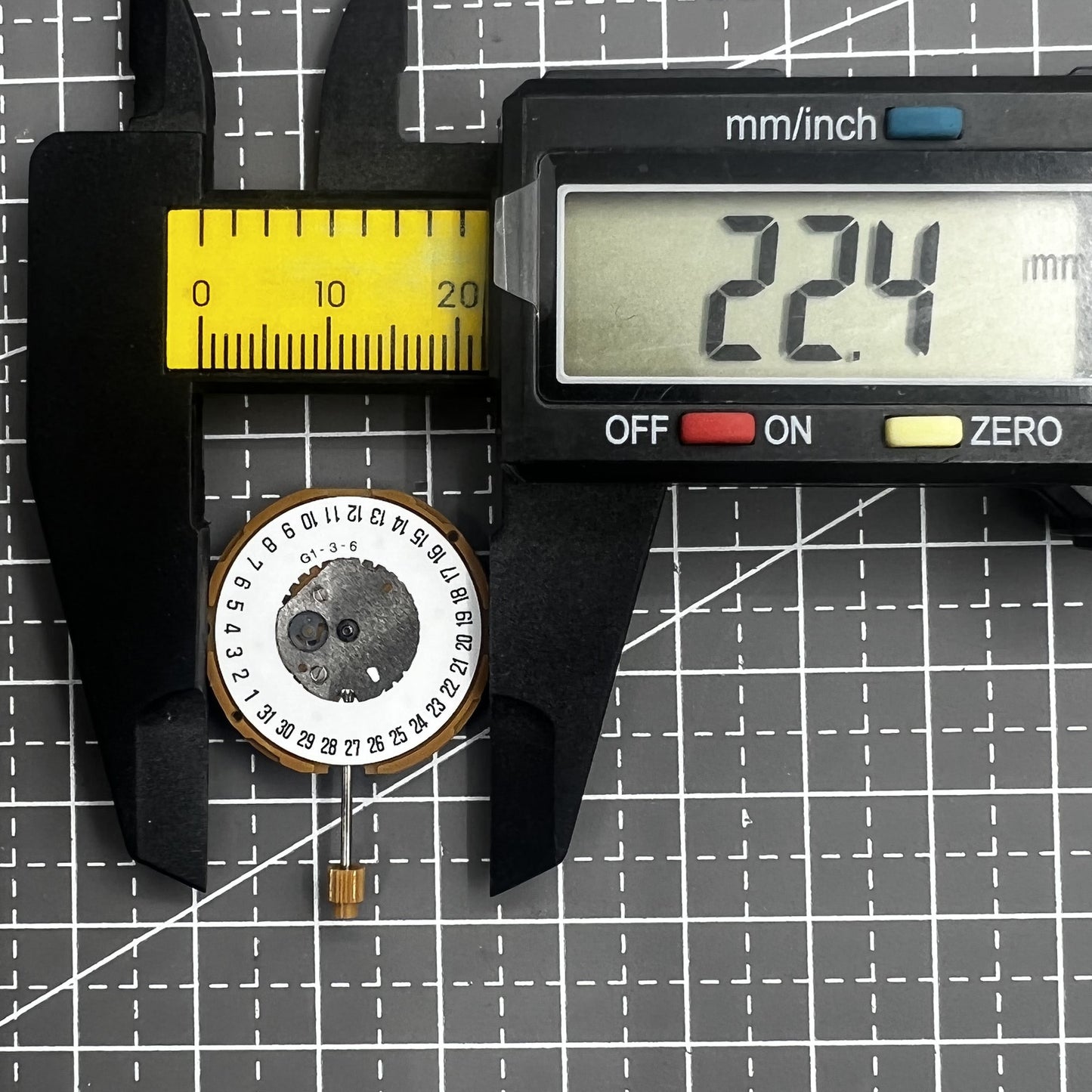 Japan Miyota GM10 watch movement with date display at 6 o'clock, precise quartz mechanism.