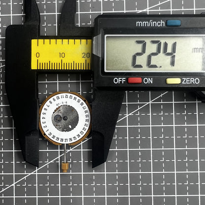 Japan Miyota GM10 watch movement with date display at 6 o'clock, precise quartz mechanism.