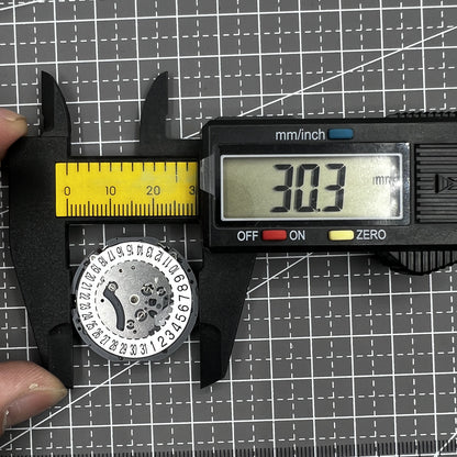 Japan Hattori VK64A quartz watch movement with date display at 6 o'clock, precise and reliable timekeeping.