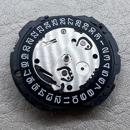 Seiko 7T12A quartz movement watch accessory with black single date display disc for precision timekeeping