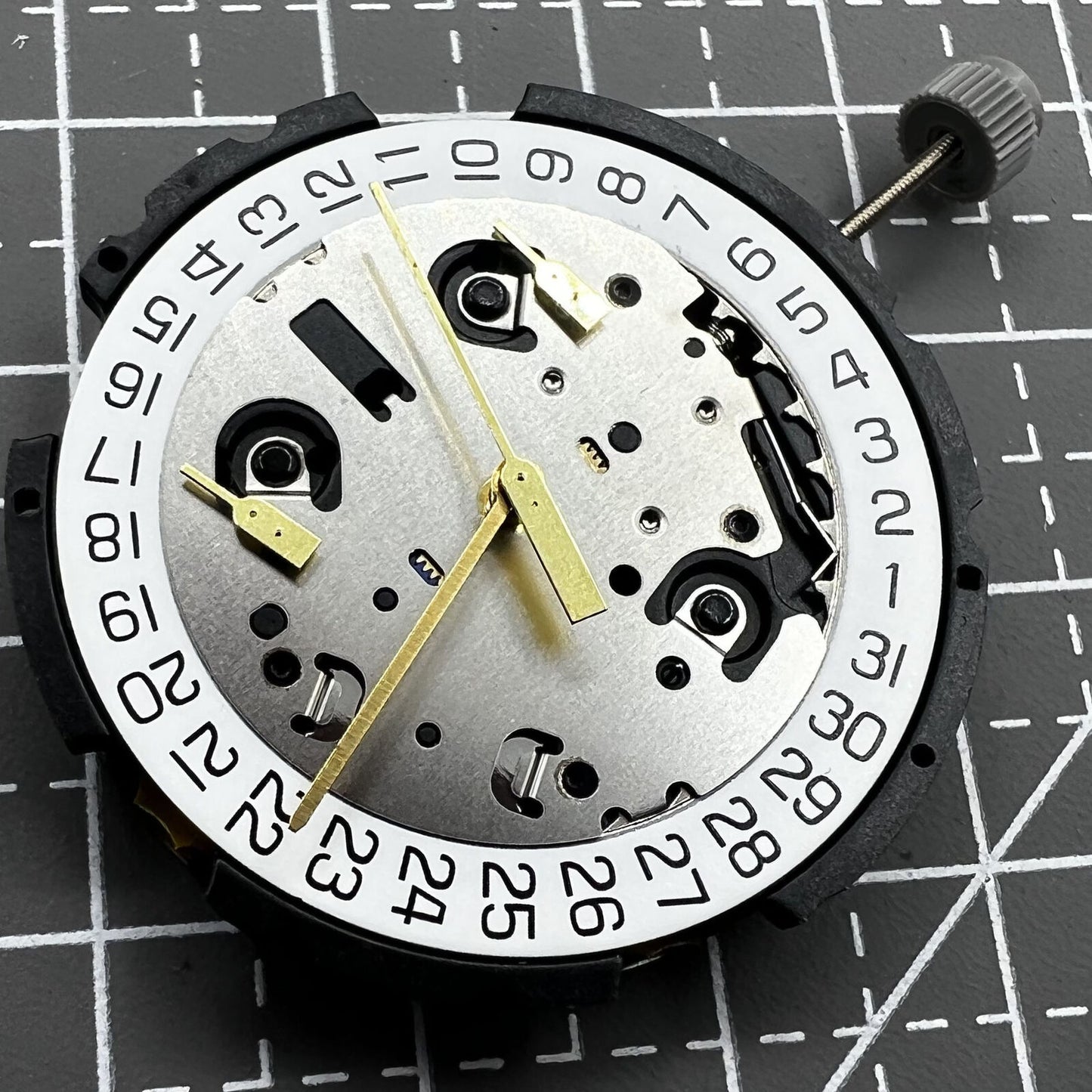 ETA G10.212 quartz watch movement with three hands and date display by ETA, precision timekeeping component.