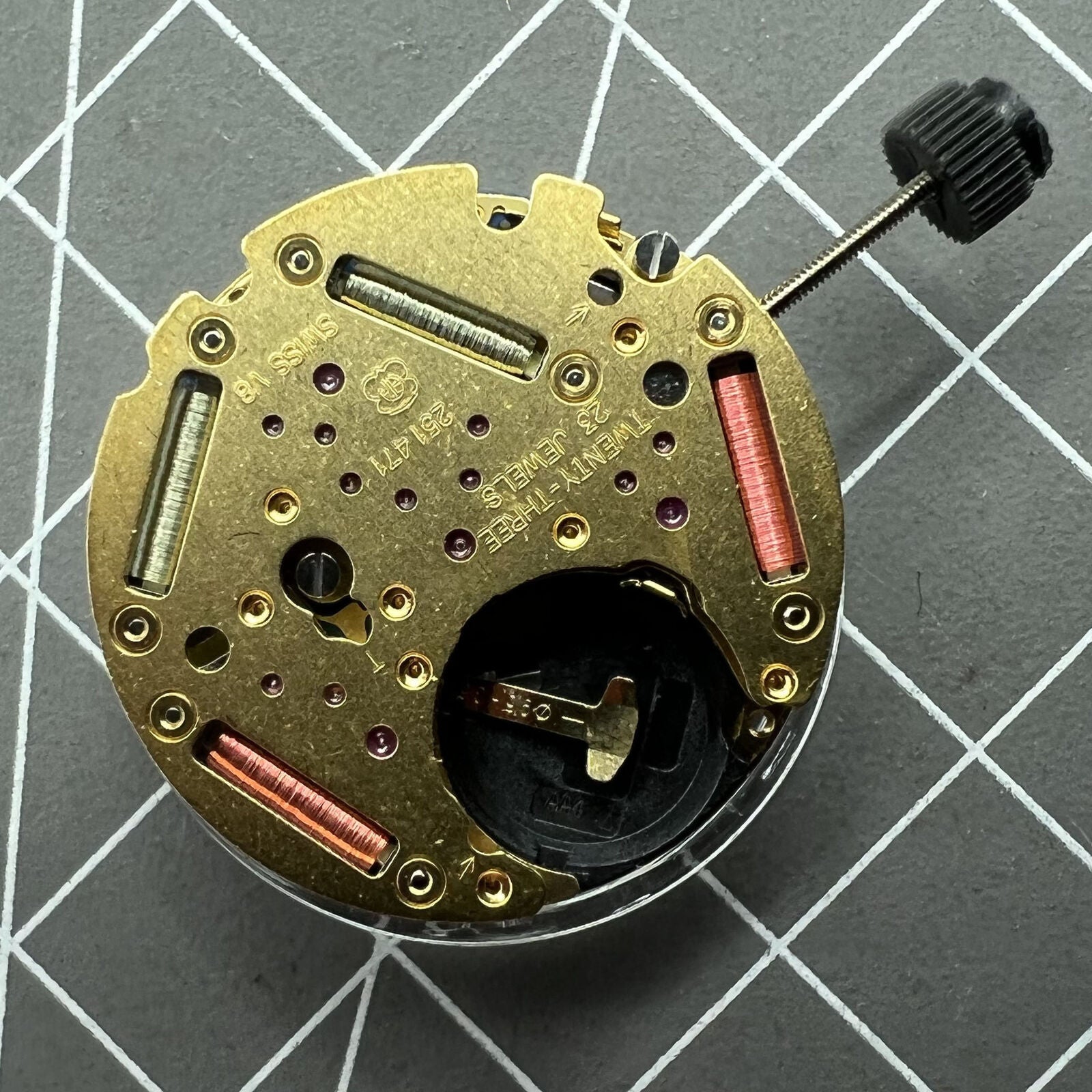 Close-up of ETA 251.471 multifunctional quartz movement highlighting precision components in a watch accessory.