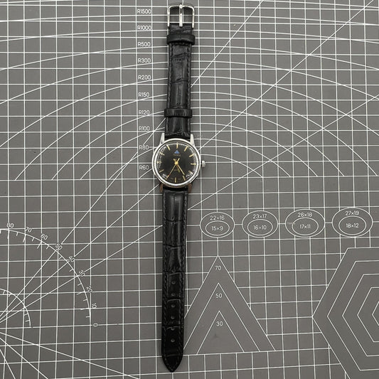 Taihang 32mm manual mechanical watch with black dial, golden nail markers, 17 jewels precision.