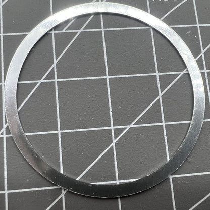 38.5mm Omega Speedmaster bezel in aluminum alloy with white ring and black font for watch customization.