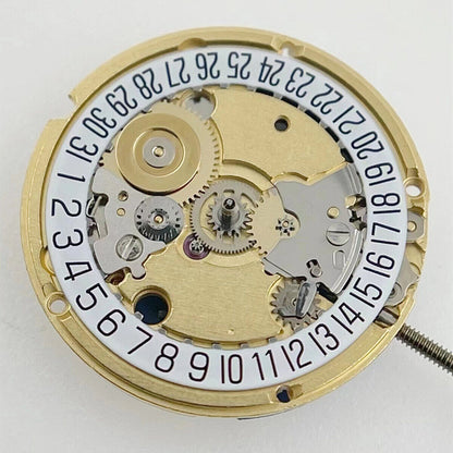 ETA 956.112 Swiss quartz watch movement with three hands and date at 6, precise timekeeping.