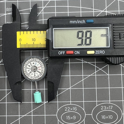 NH06A Japan-made watch movement with double calendar date display at 3 o'clock, precision engineering.